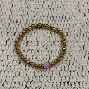 Gold Beaded Stretch Bracelet with Pink Accent Bead